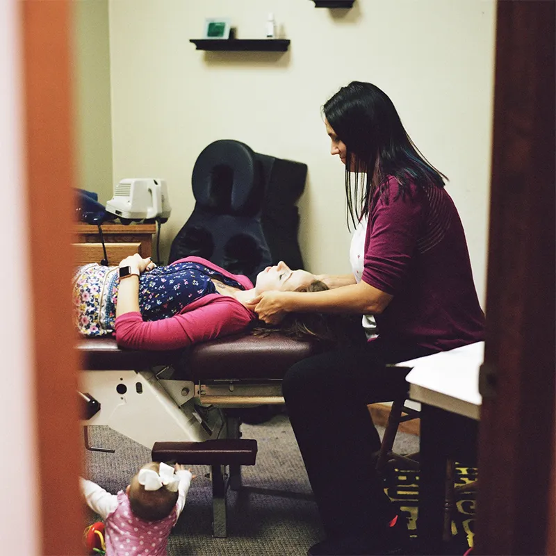 Chiropractor Adjusting Patient at Allegheny Health & Physical Medicine in Natrona Heights, PA.