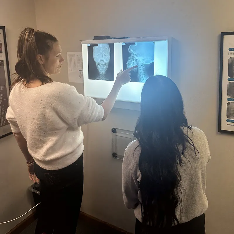 Chiropractor in Natrona Heights, PA Going Over Chiropractic X-Rays with Patient.